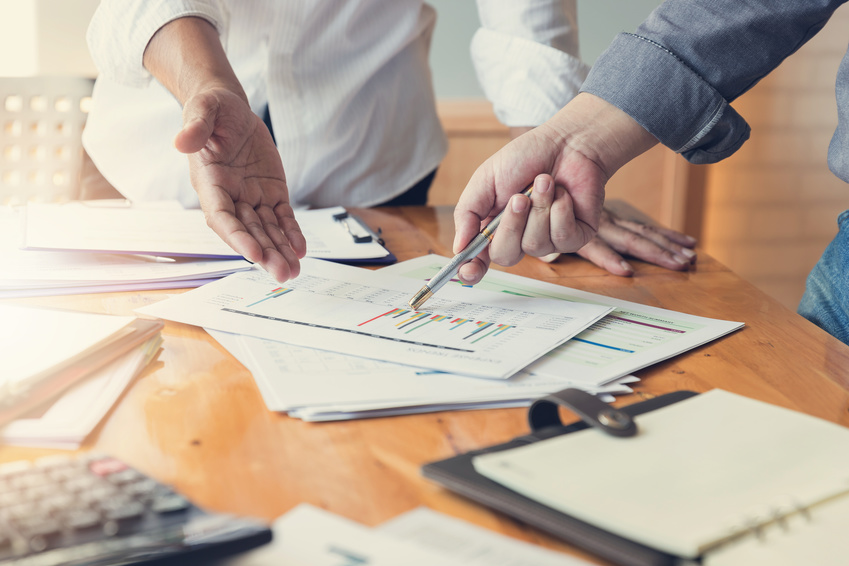 Business and finance concept of office working,Teamwork of Businessmen discussing analysis Chart
